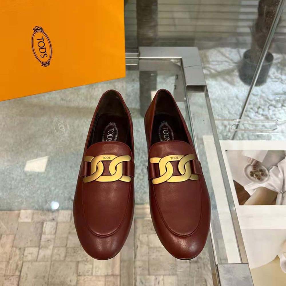 Close-up of metal branded detail on TODS Women Kate Loafers