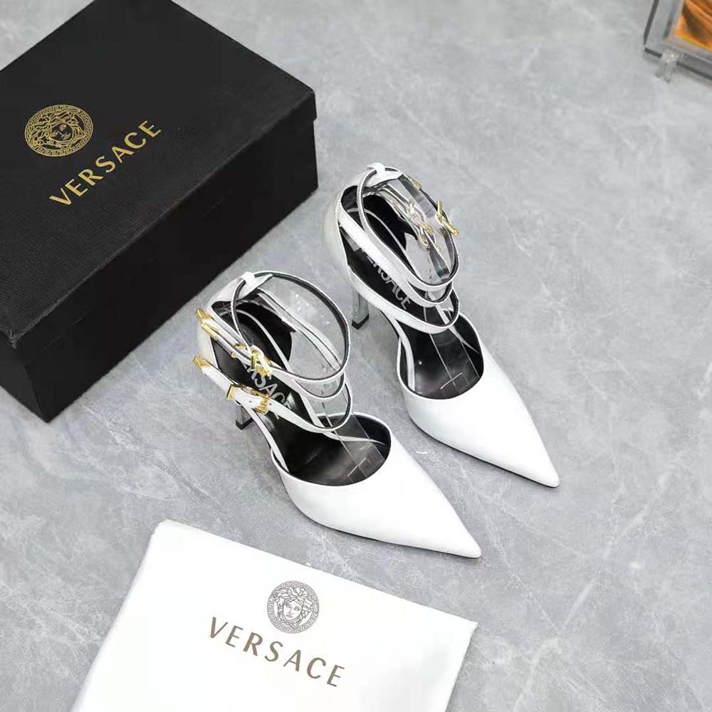 Close-up of gold Medusa emblem on Versace Women Pin-Point Pumps
