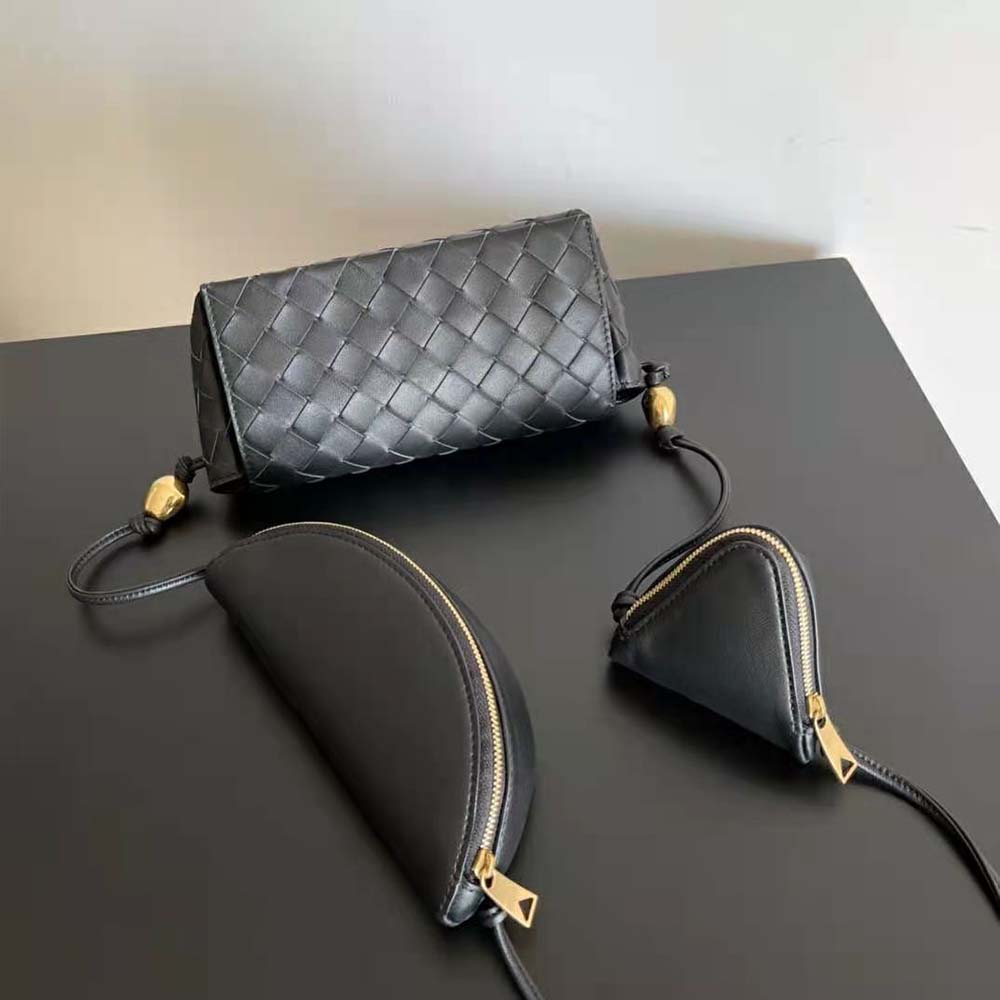 Side angle showing adjustable strap and gold hardware on Bottega Veneta pouch