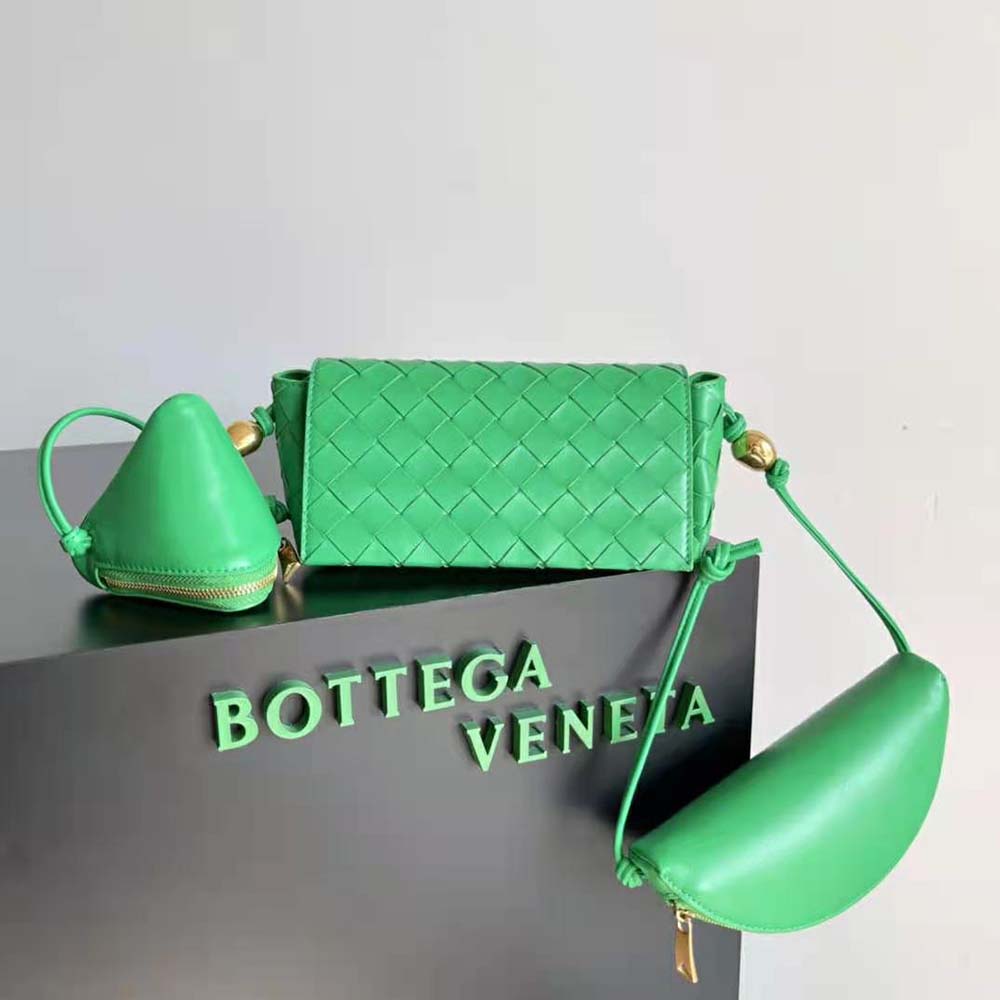 Close-up of green intrecciato leather texture and silver-tone hardware