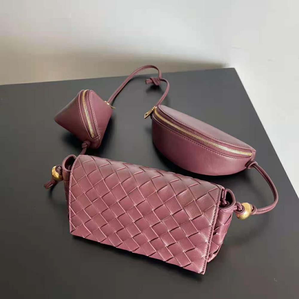 Side angle showing gold hardware and strap detail on Bottega Veneta pouch