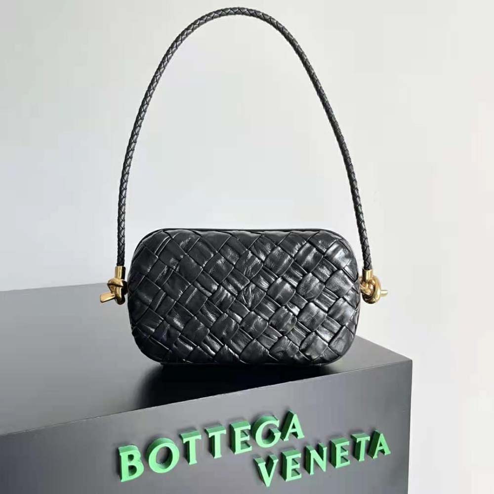 Close-up detail of intrecciato leather and gold hardware on Bottega Veneta bag