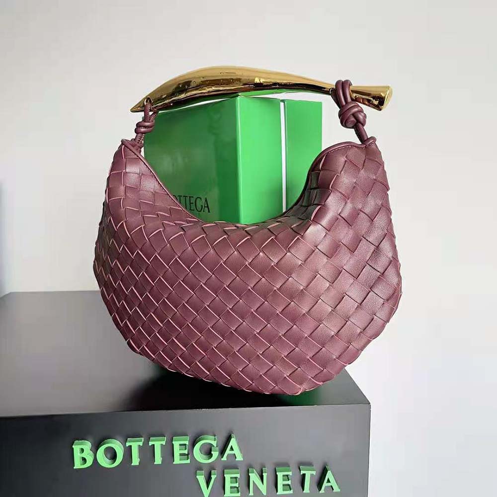 Side profile showcasing intrecciato leather texture on Bottega Veneta Sardine Top Handle Bag-Maroon