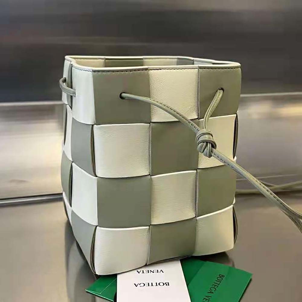 Side angle of lime bucket bag highlighting compact silhouette and magnetic closure
