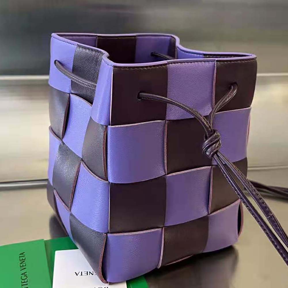 Side angle showing silver hardware and adjustable strap of the Bottega Veneta bag