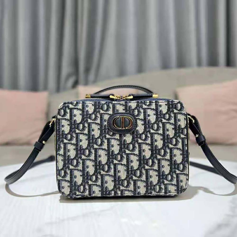 Side profile showcasing the compact silhouette and shoulder strap of Dior Women 30 Mmontaigne Box Bag