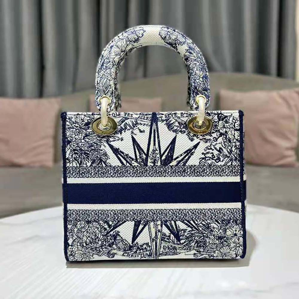Side angle showing silver hardware and flap closure on Dior Women Medium Lady D-lite Bag