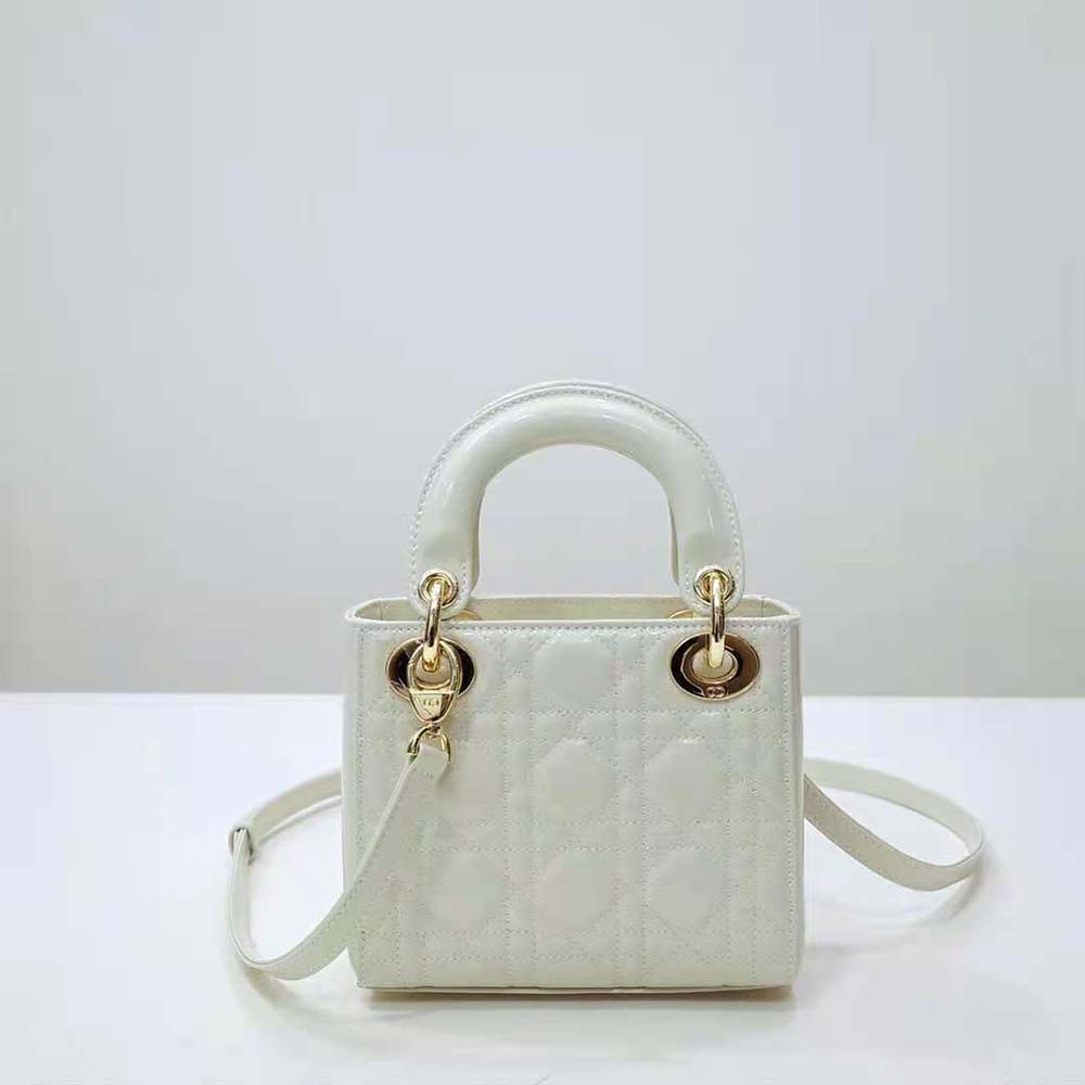 Side view showing strap and glossy white patent leather, Dior Women Mini Lady Dior Bag
