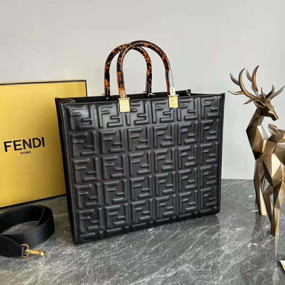 Close-up of gold-tone signature hardware on Fendi Women Sunshine shopper