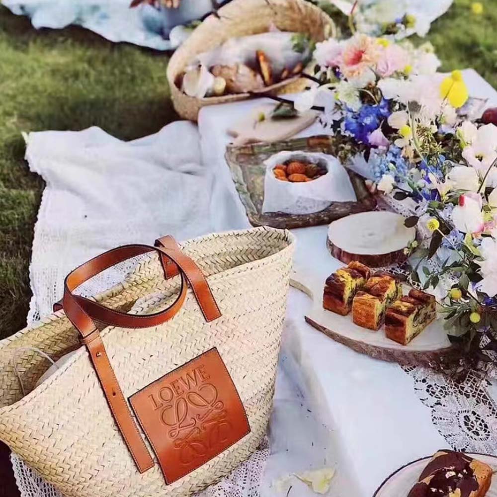Close-up of beige calfskin trim and gold hardware on Loewe basket bag