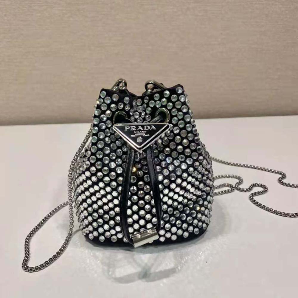 Close-up of gold-tone hardware and crystal embellishment on Prada Mini-Pouch