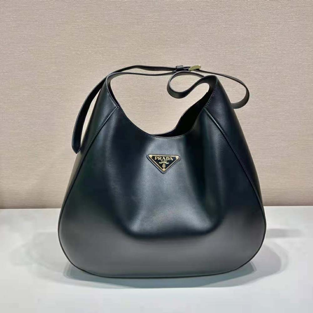 Close-up of silver hardware and black leather topstitch detail, Prada bag