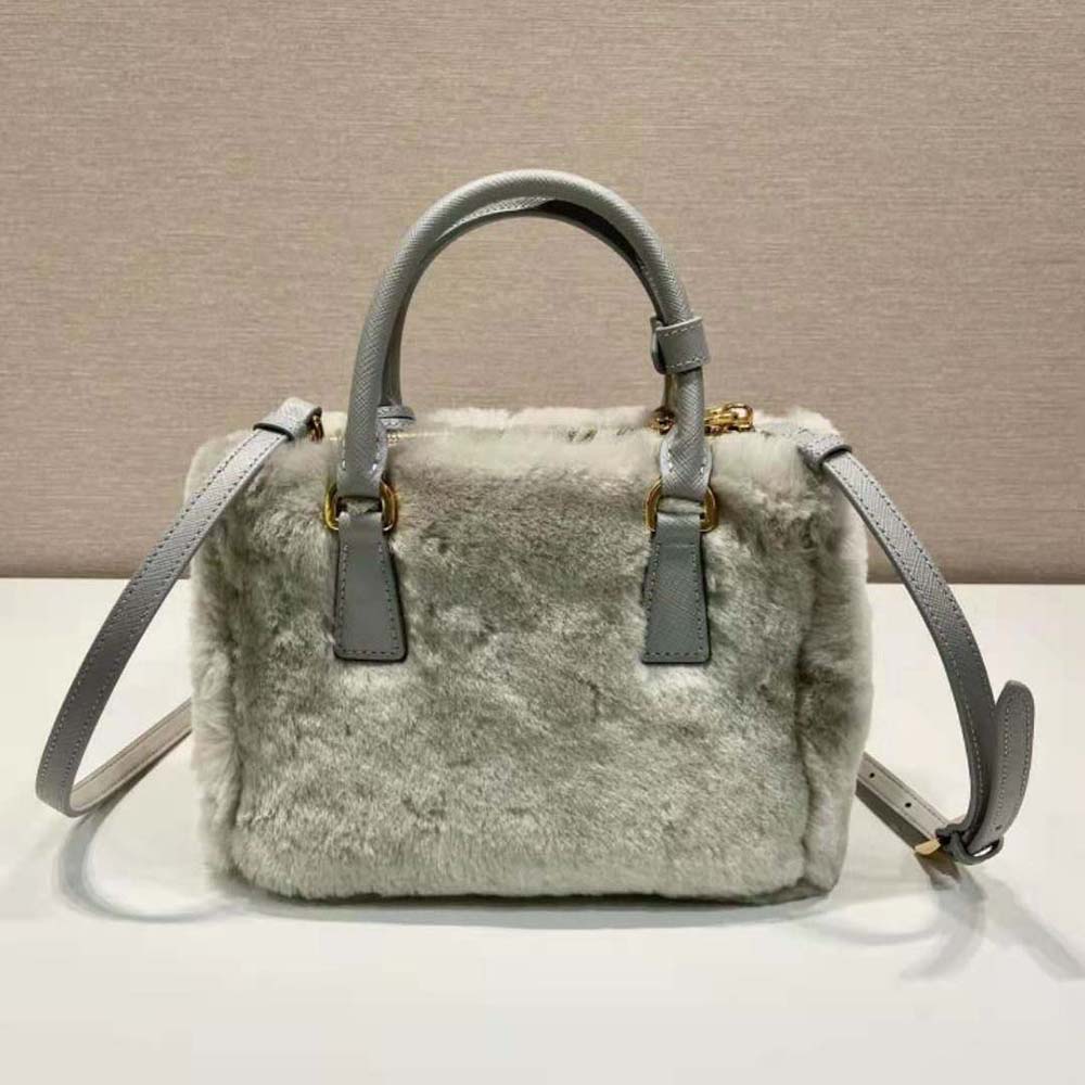 Side angle showing compact silhouette of Prada Women Prada Galleria Shearling Mini-Bag-Silver