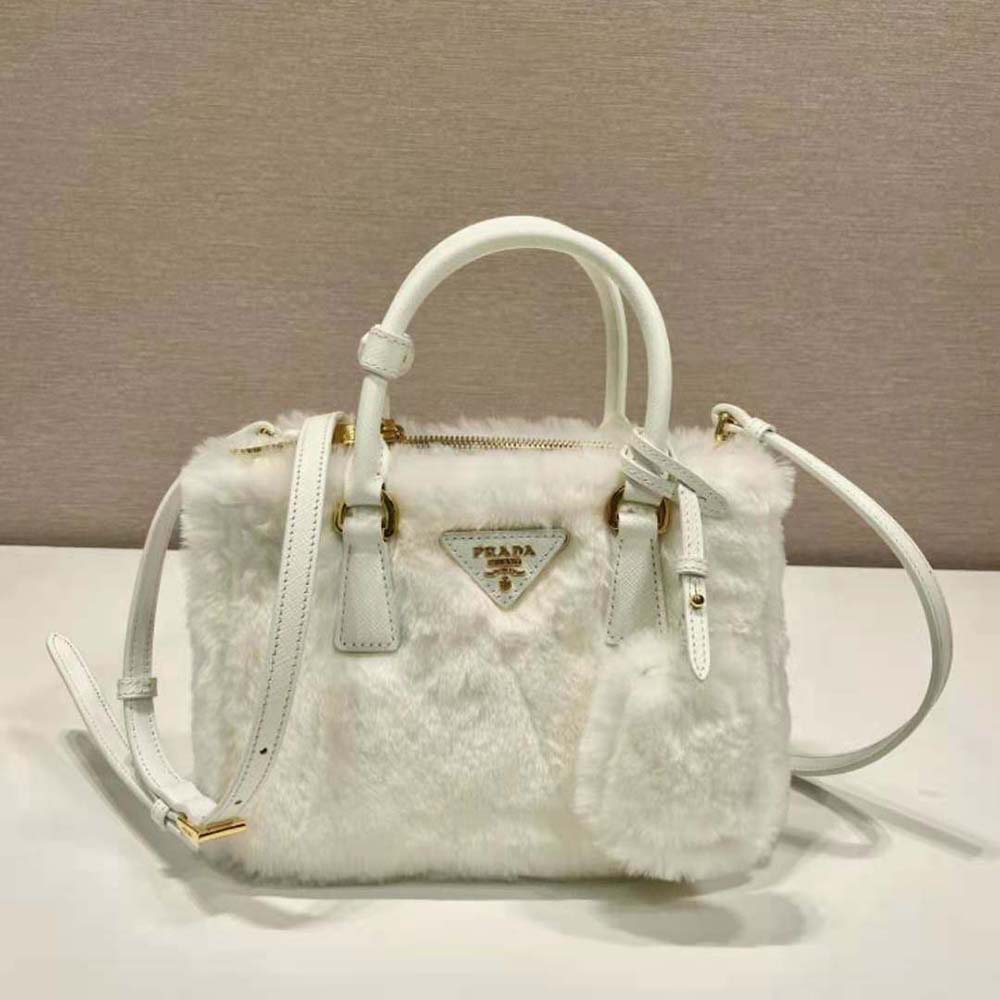 Close-up of silver-tone closure detail on Prada Galleria Shearling Mini-Bag-White