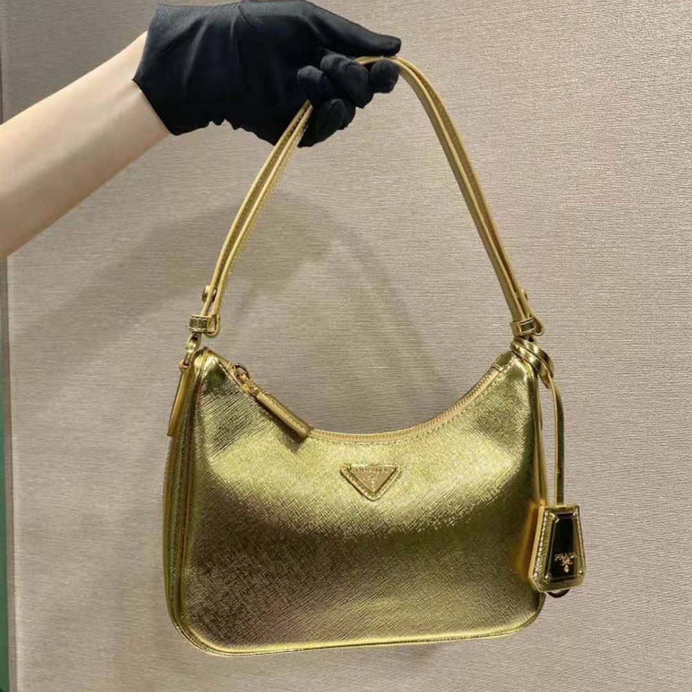 Close-up of gold hardware and saffiano leather texture on Prada bag