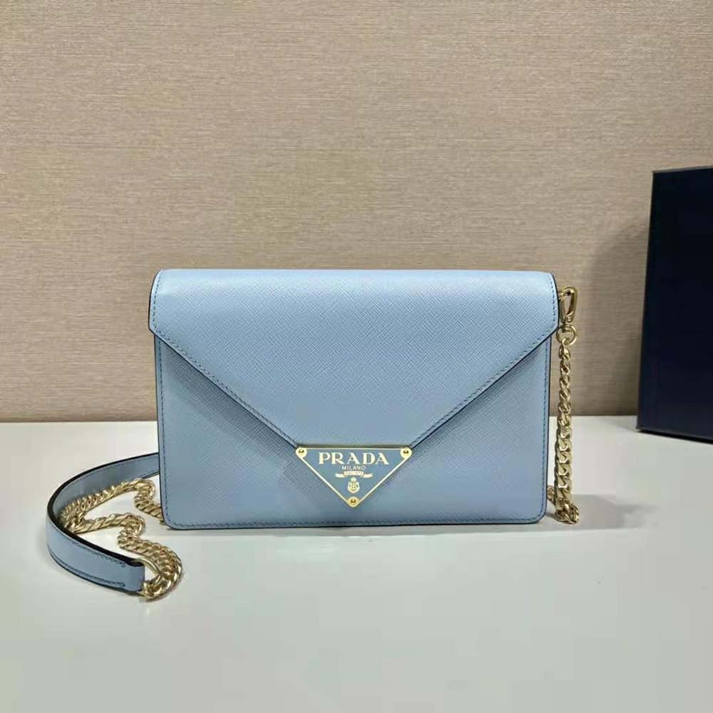 Side angle highlighting structured silhouette of Prada Women Saffiano Leather Shoulder Bag-Blue