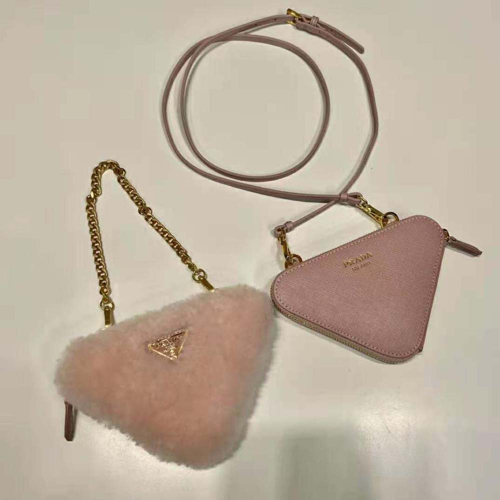 Side angle showing silver hardware on Prada Women Shearling and Saffiano Leather Mini-Pouch-Pink