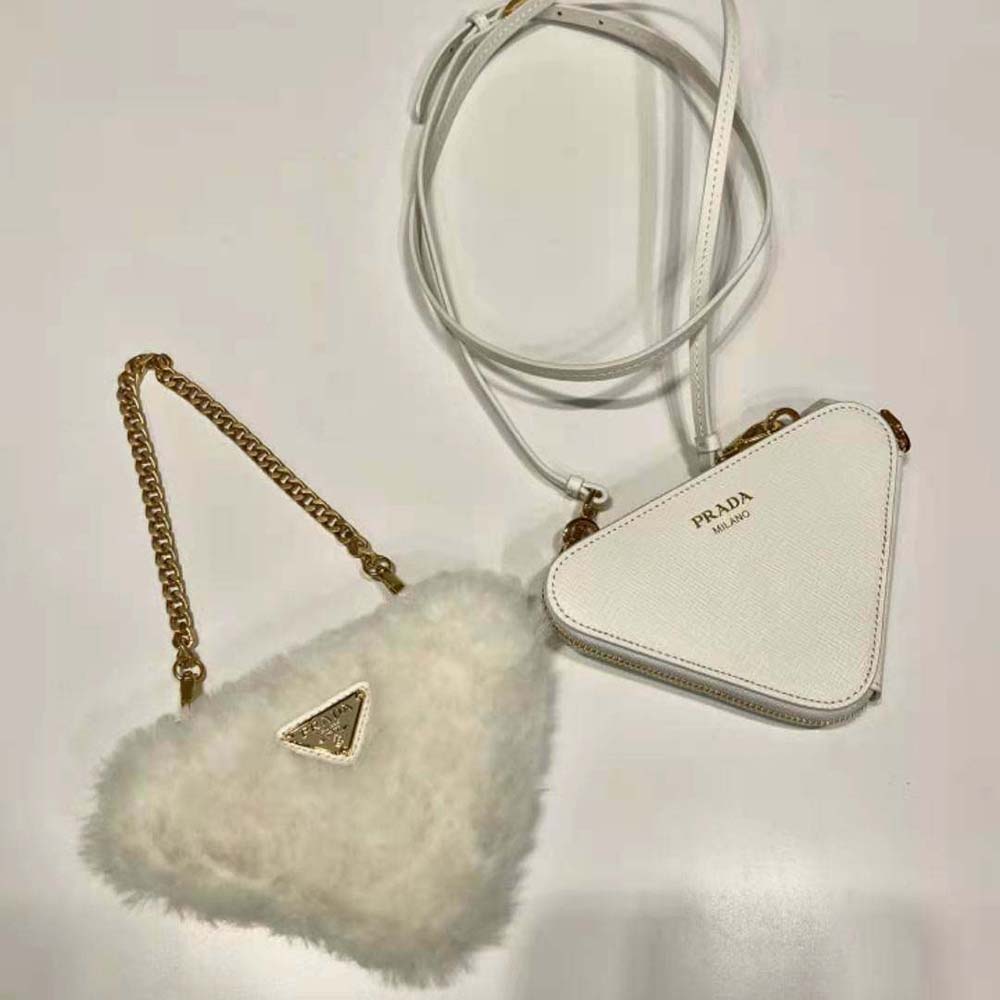 Side angle showing compact silhouette of Prada mini-pouch in white