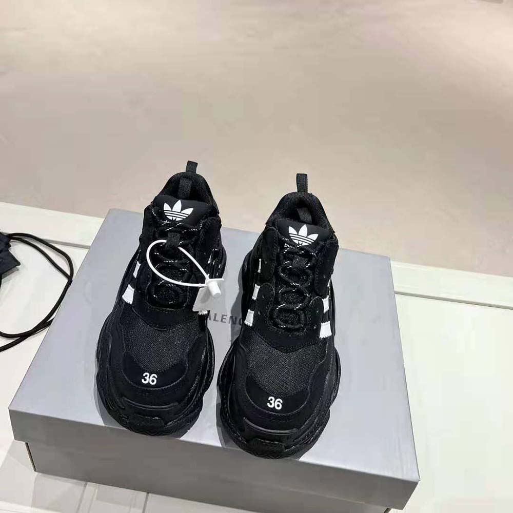 Close-up of black leather and mesh details on Balenciaga Triple S sneaker