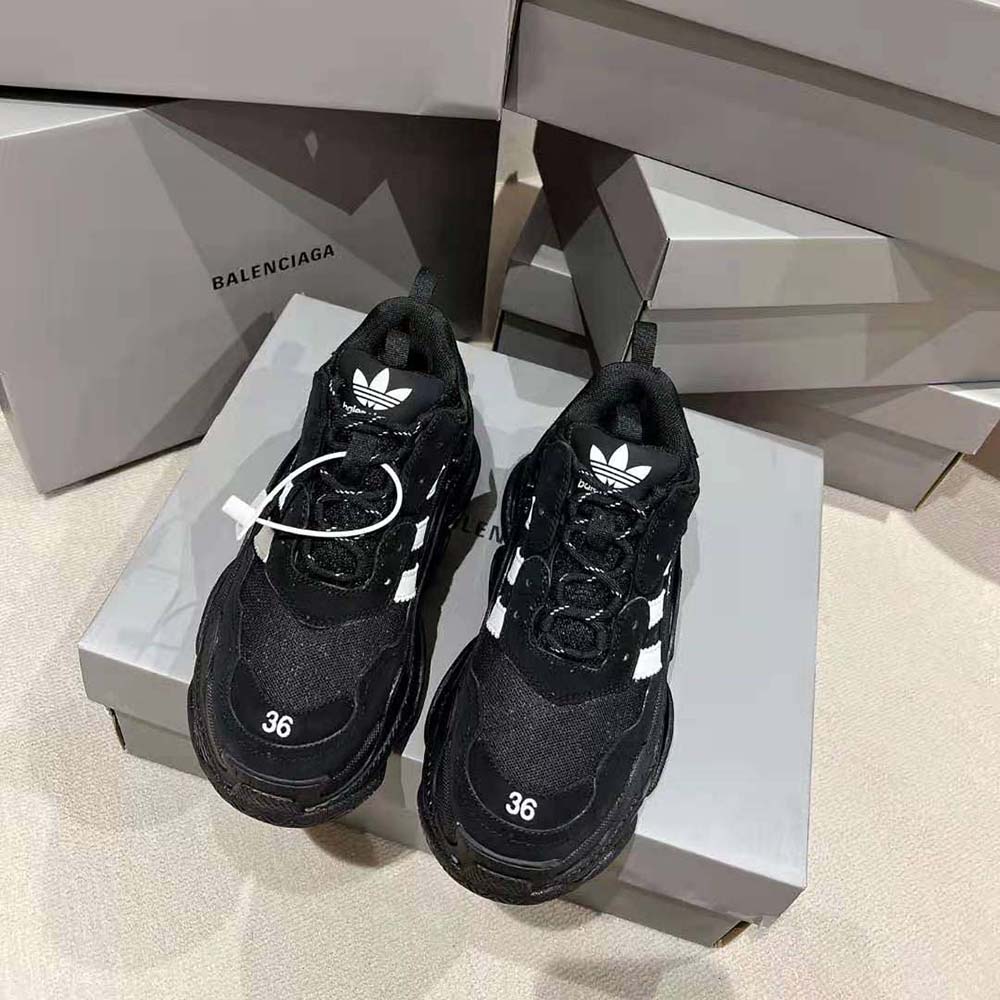 Overhead angle showing triple-layered sole of Balenciaga Unisex Triple S sneaker
