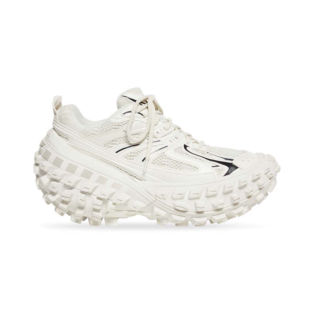 Side profile of Balenciaga Unisex Defender Sneaker in light beige