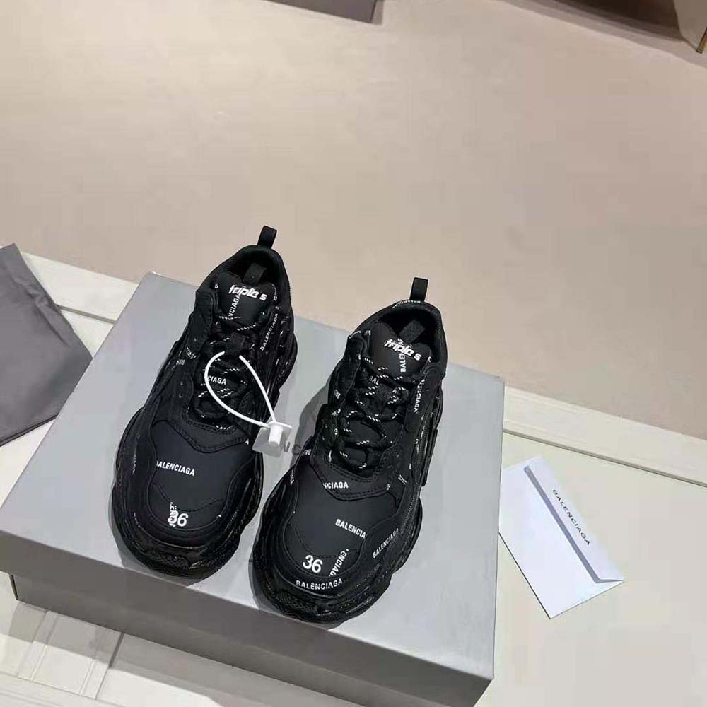 Close-up of logo print and technical material on Balenciaga Triple S sneaker