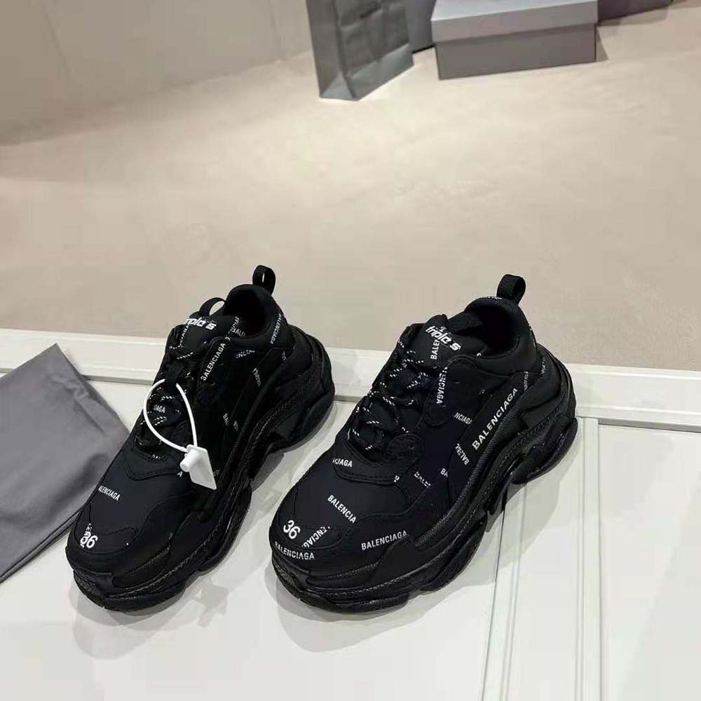 Angled view showing the chunky sole and lace-up detail of Balenciaga Triple S sneaker