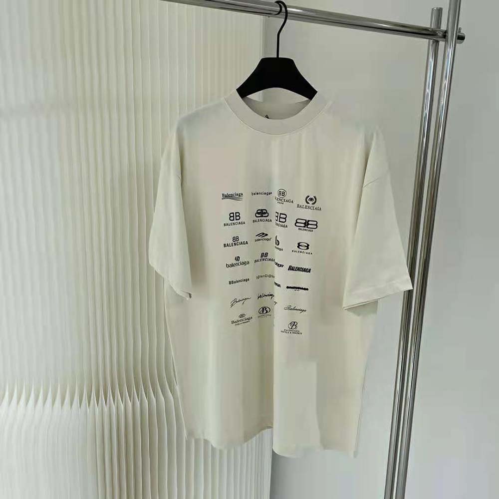 Close-up detail of Balenciaga Archives logo print on light beige T-shirt
