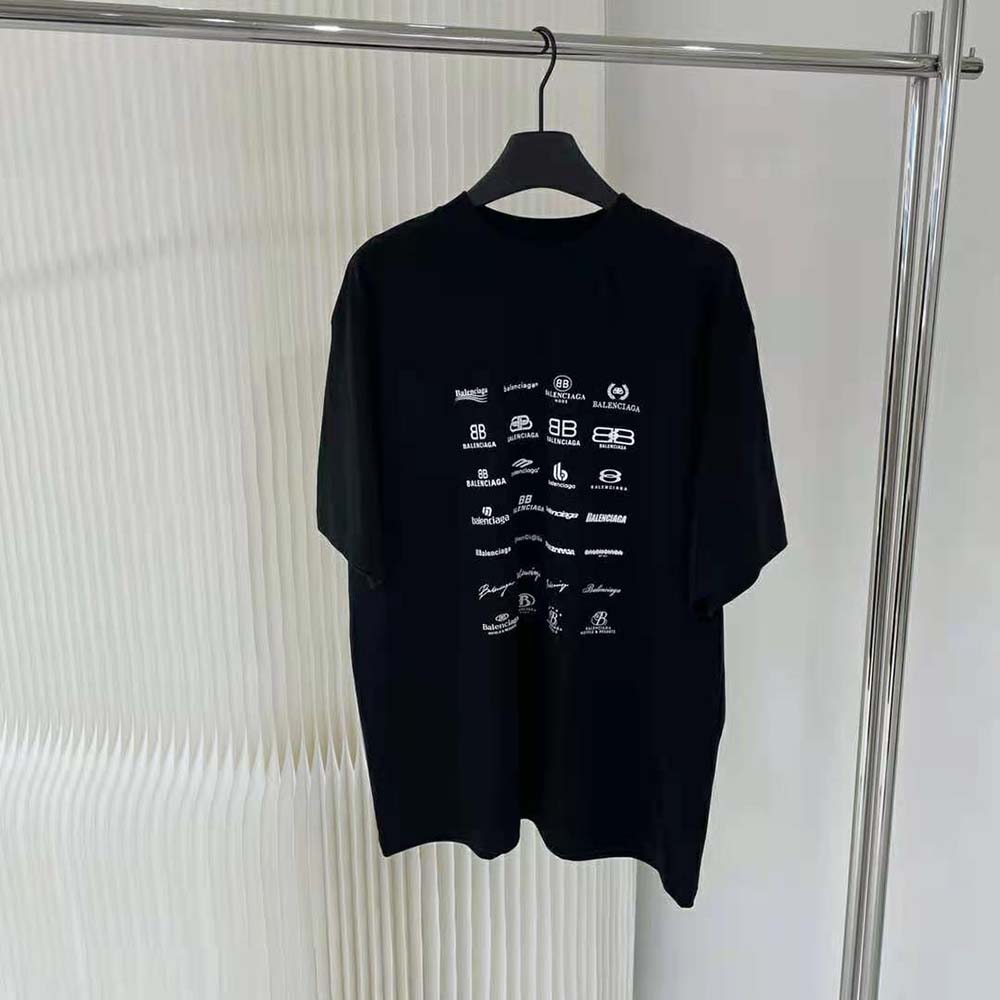Close-up of Balenciaga logo print on light black oversized T-shirt