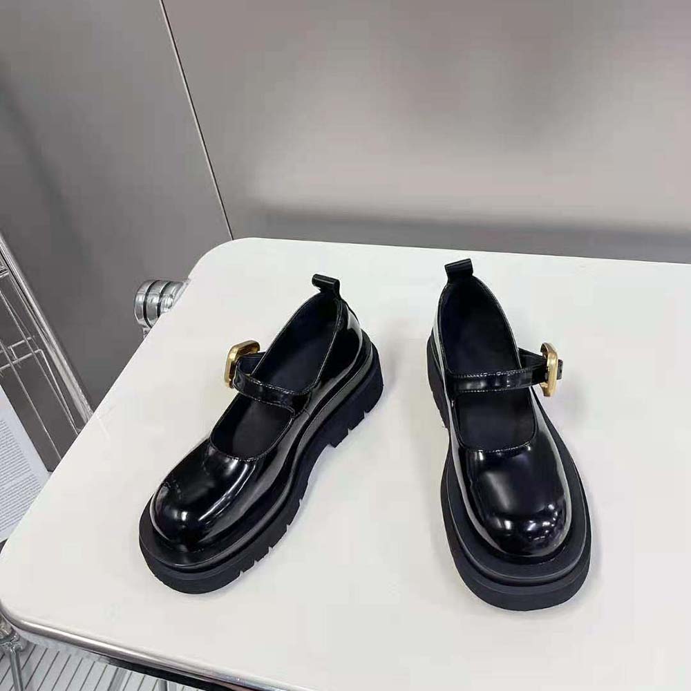 Side view showing chunky lug sole and buckle closure