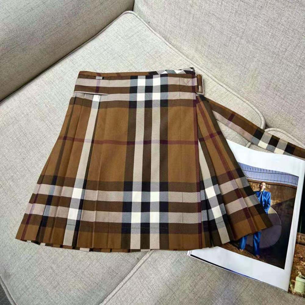 Close-up detail of signature Burberry check on wool pleated skirt