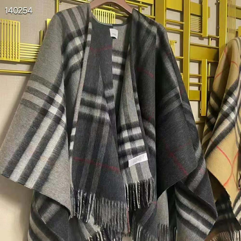 Side profile of flowing silhouette on Burberry Women Contrast Check Cape