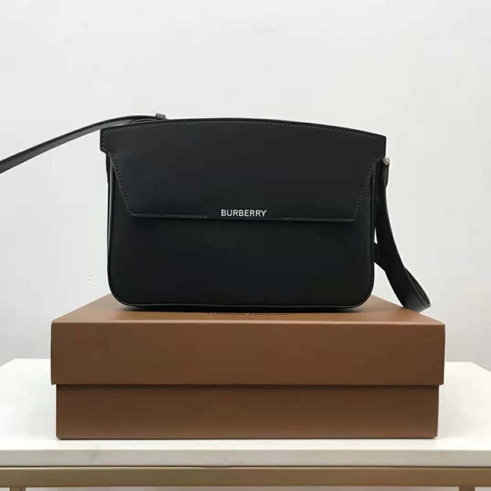 Close-up of signature gold Burberry logo on Catherine Shoulder Bag-Black