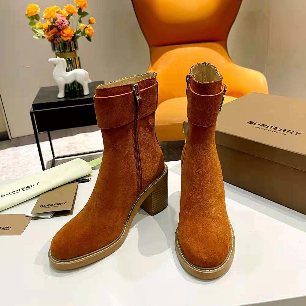 Back view showing block heel and zipper of Burberry suede boots