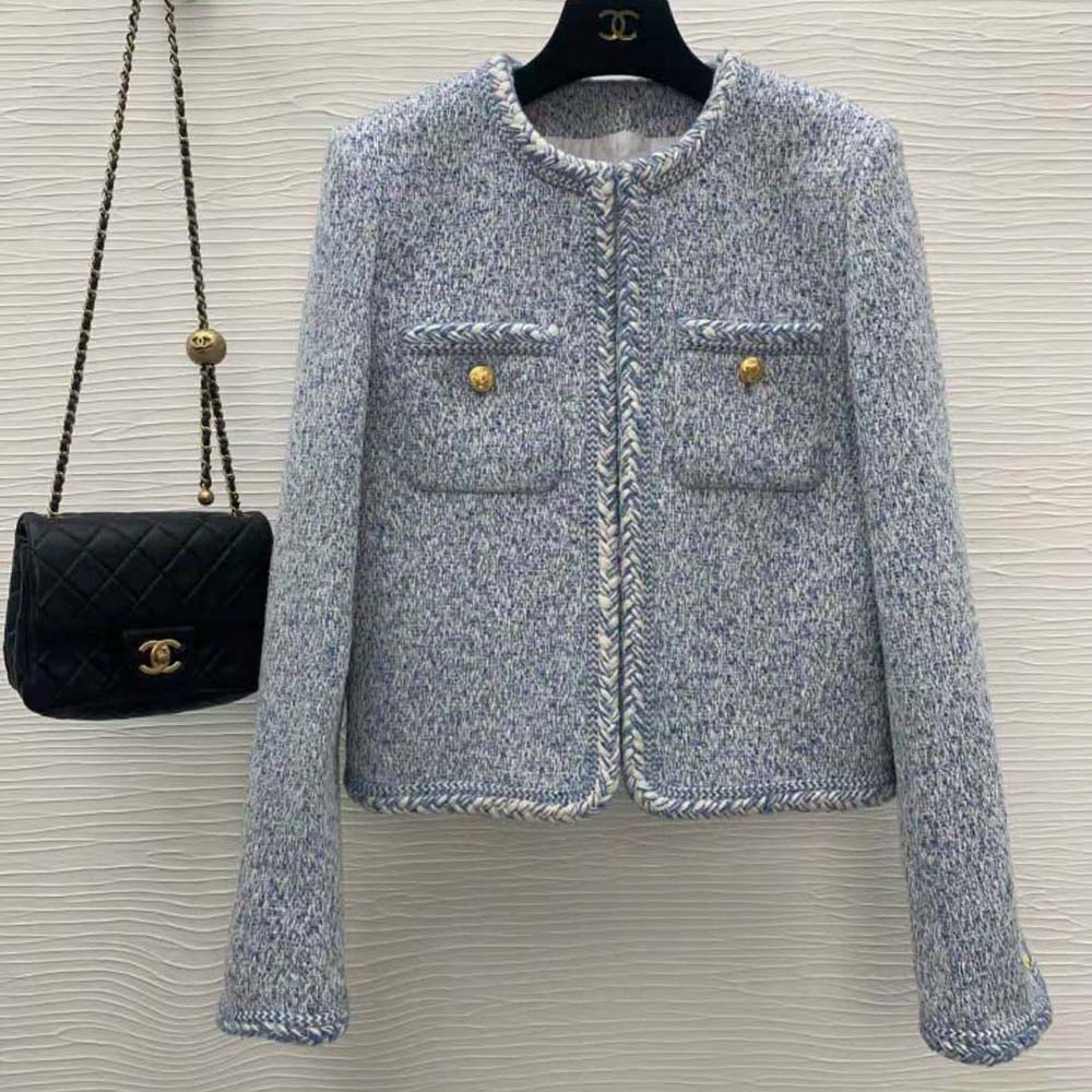 Close-up detail of blue wool natté fabric and buttons on Celine jacket