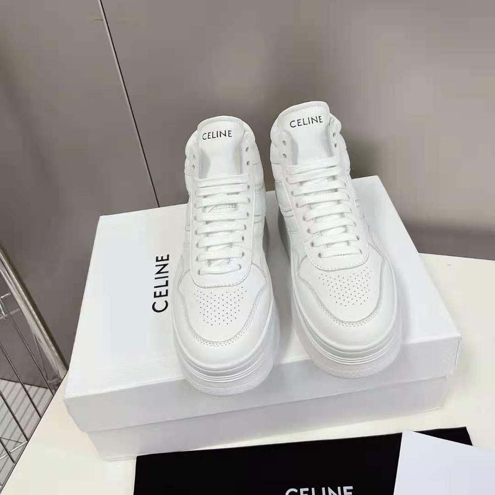 Close-up detail of Celine embossed logo on white calfskin sneaker wedge