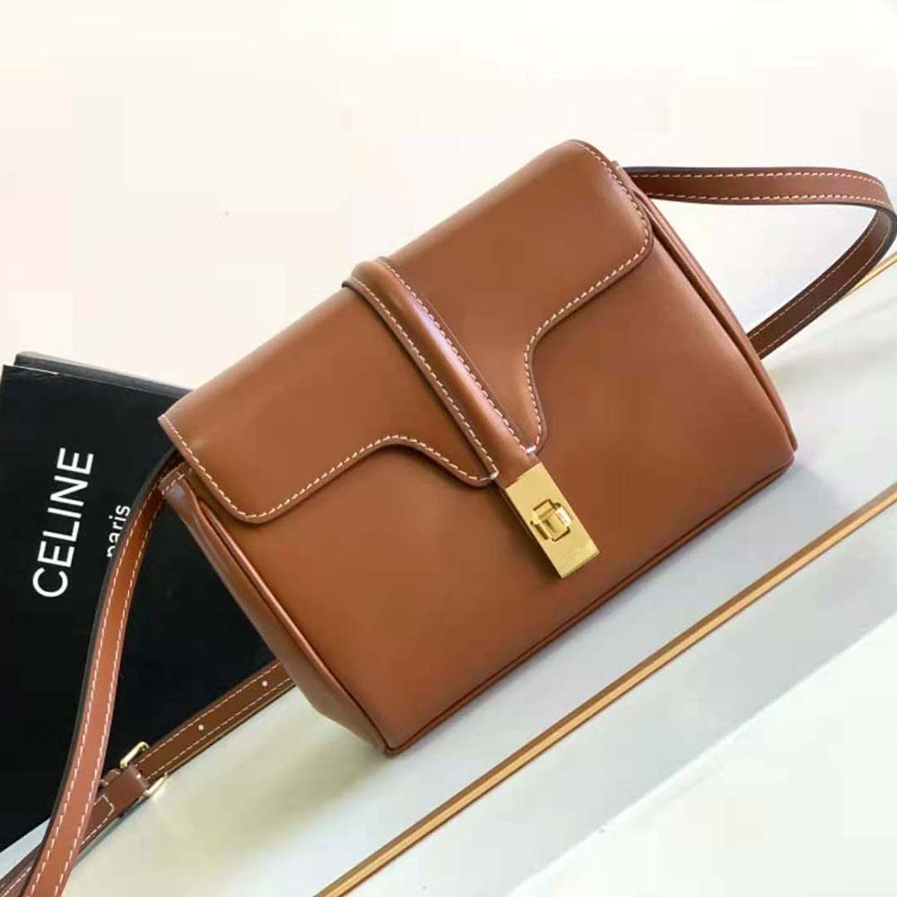 Close-up of gold hardware and smooth calfskin leather detail