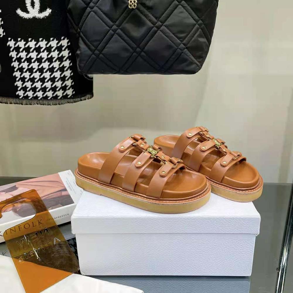 Close-up on embossed Celine logo detail on Tippi slides