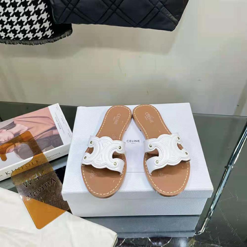 Close-up of gold Triomphe detail on white calfskin Celine Women Triomphe Mule