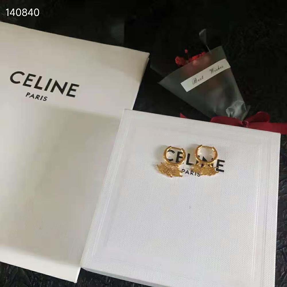 Close-up detail of gold finish on Celine Women Triomphe Trio Hoops