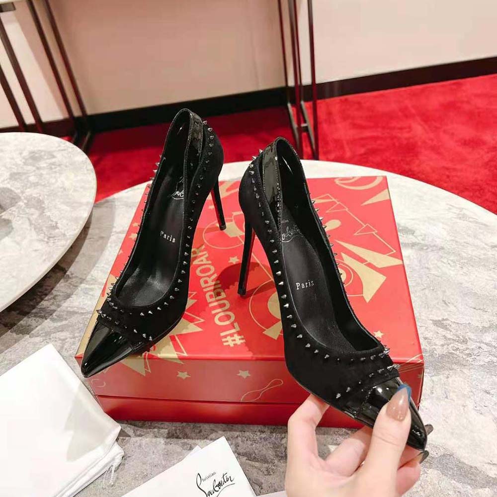 Rear angle showing red sole and stiletto heel of Christian Louboutin Duvette Spikes