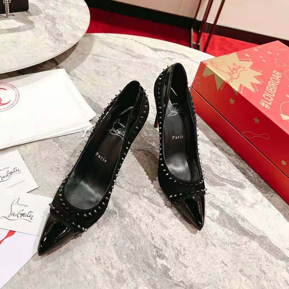 Close-up of black leather and spike details on Christian Louboutin Duvette