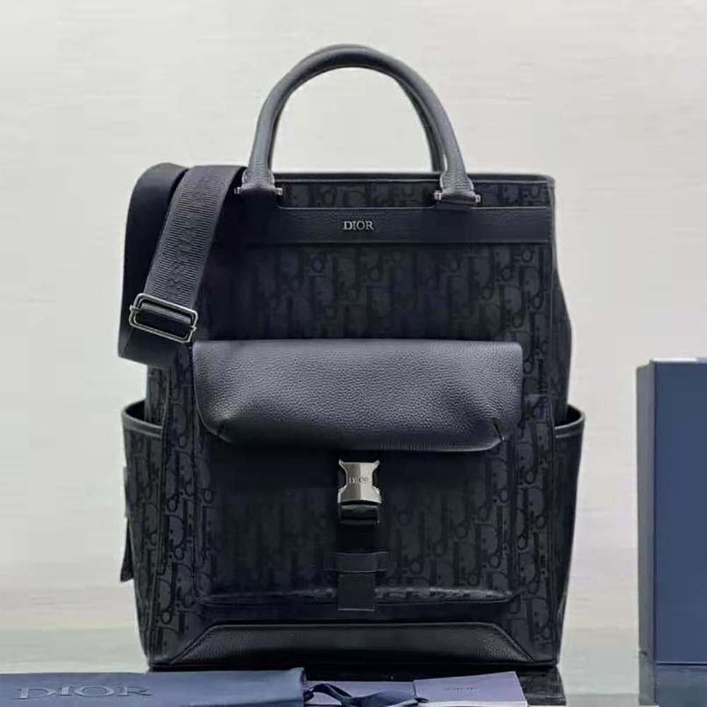 Close-up of grained calfskin and silver hardware on Dior Men Explorer Tote Bag