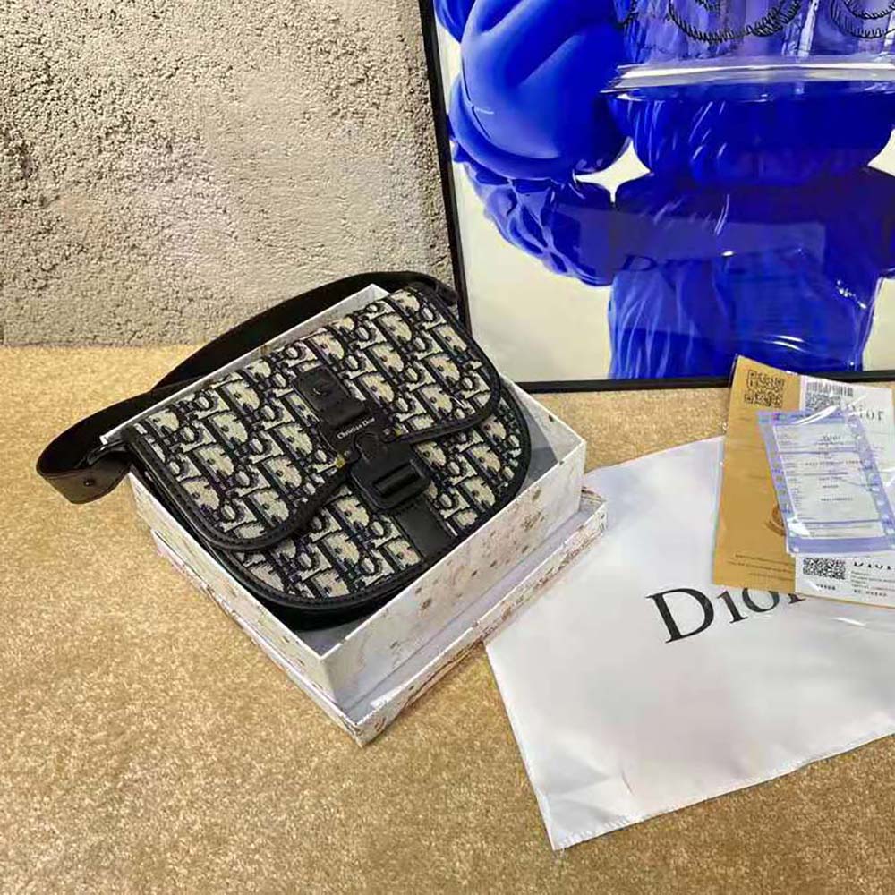 Close-up of Dior Oblique jacquard fabric and gunmetal hardware detail