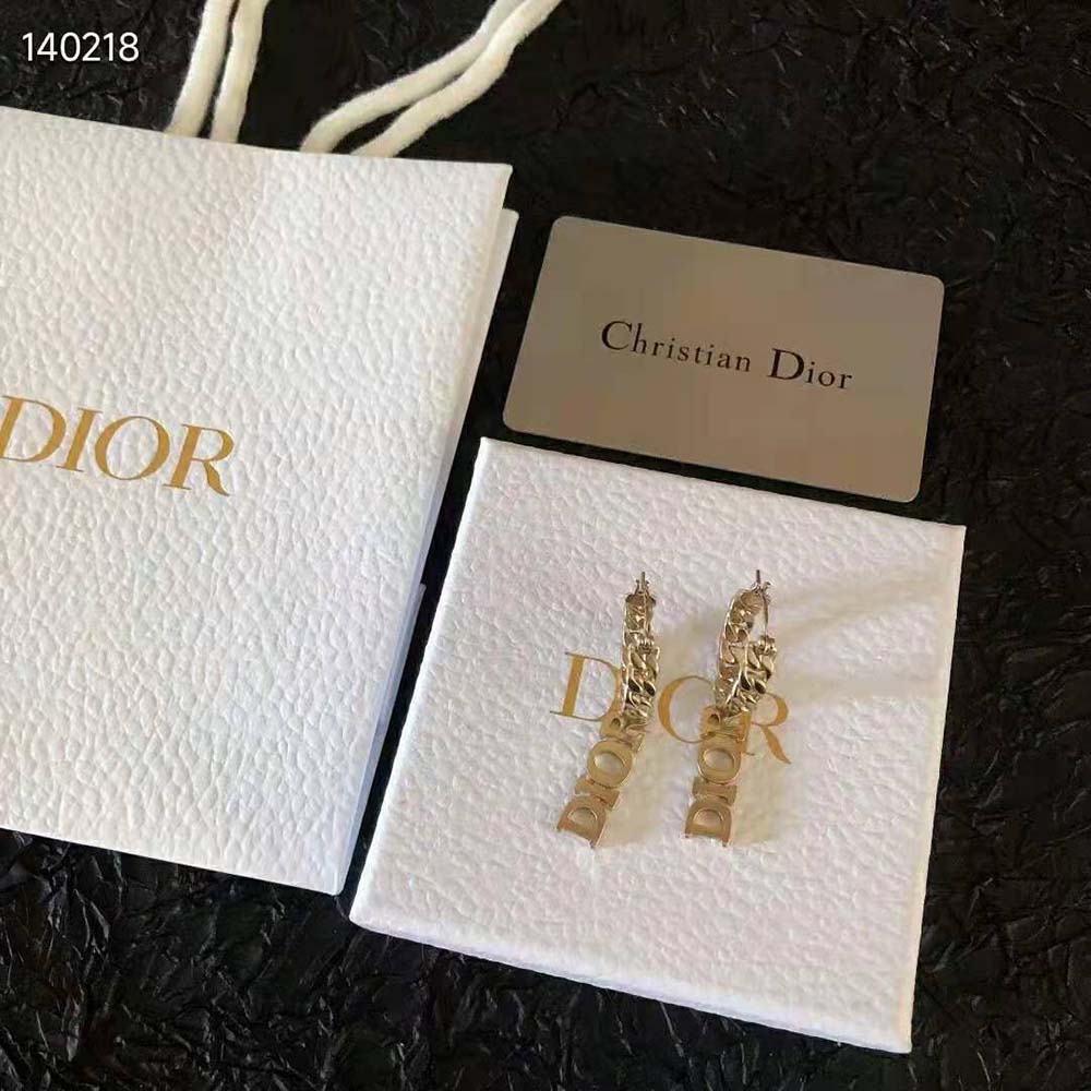 Close-up detail of gold finish and Dior logo on Dio(r)evolution Earrings
