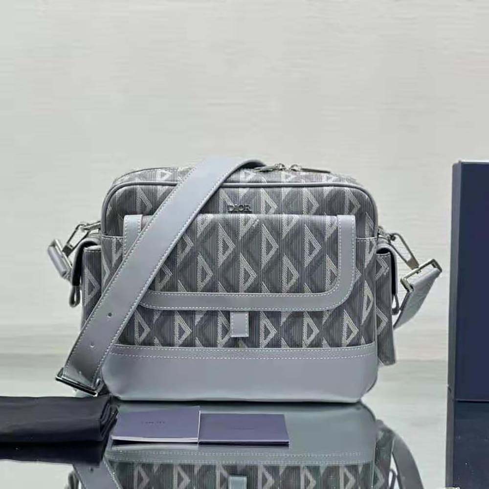 Close-up detail of smooth calfskin and matte hardware on Dior Men Hit the Road Pouch