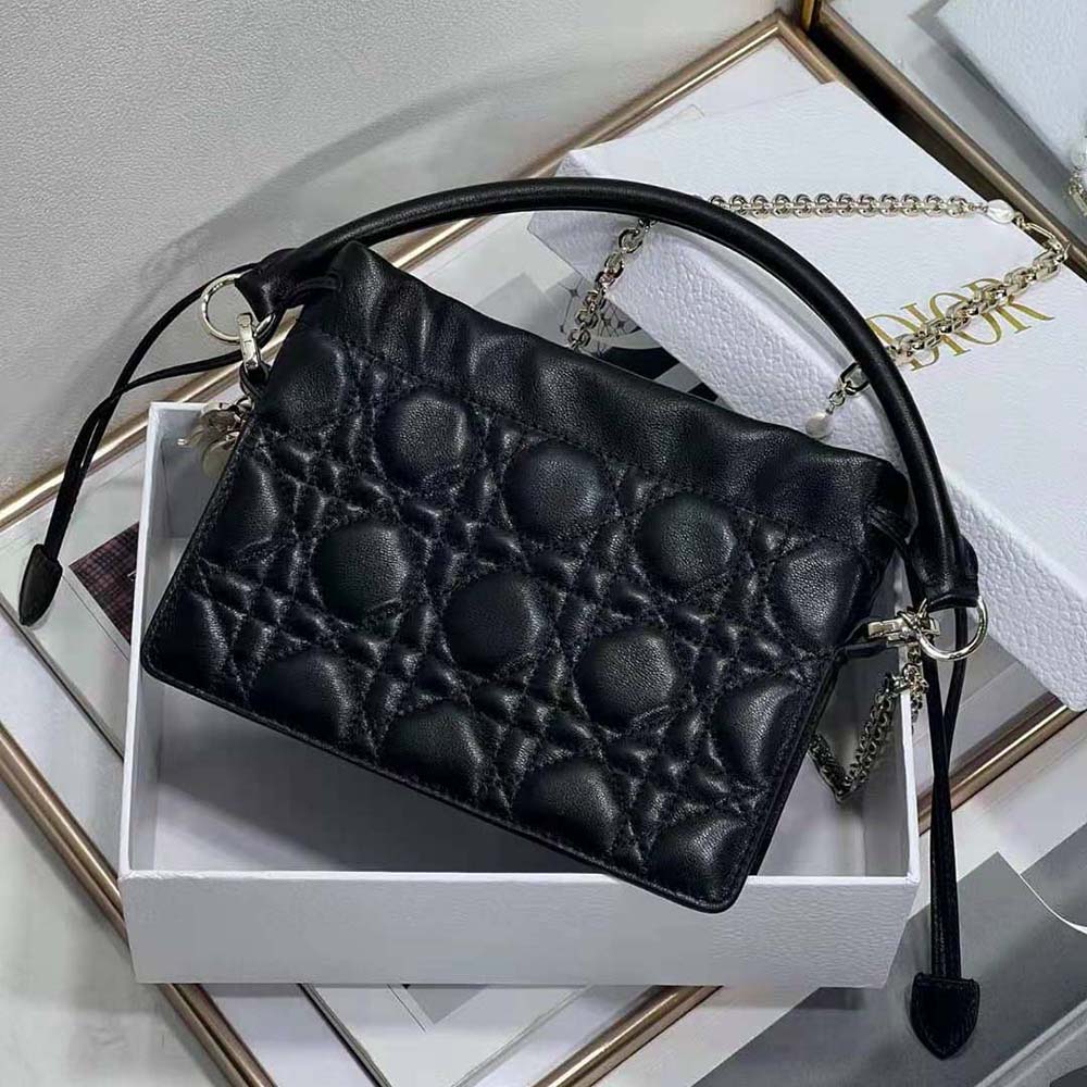 Side angle showing drawstring closure and compact shape of Lady Dior mini bag