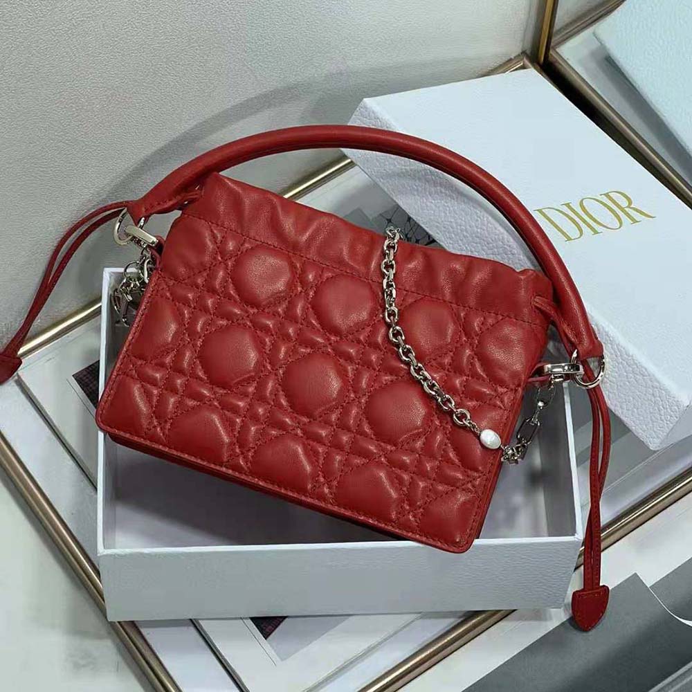 Side angle showing drawstring closure and top handle of Lady Dior Mini Bag
