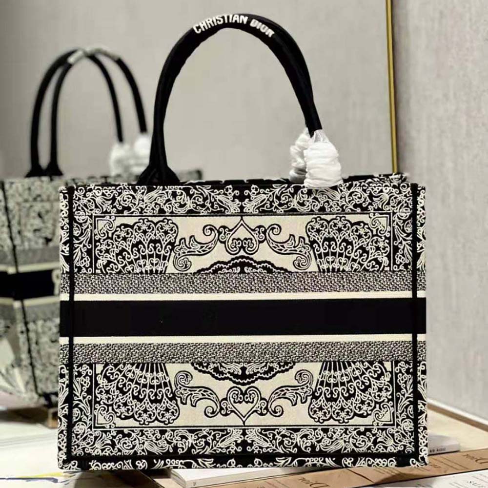 Side angle showcasing silhouette of Dior Women Medium Dior Book Tote Black canvas