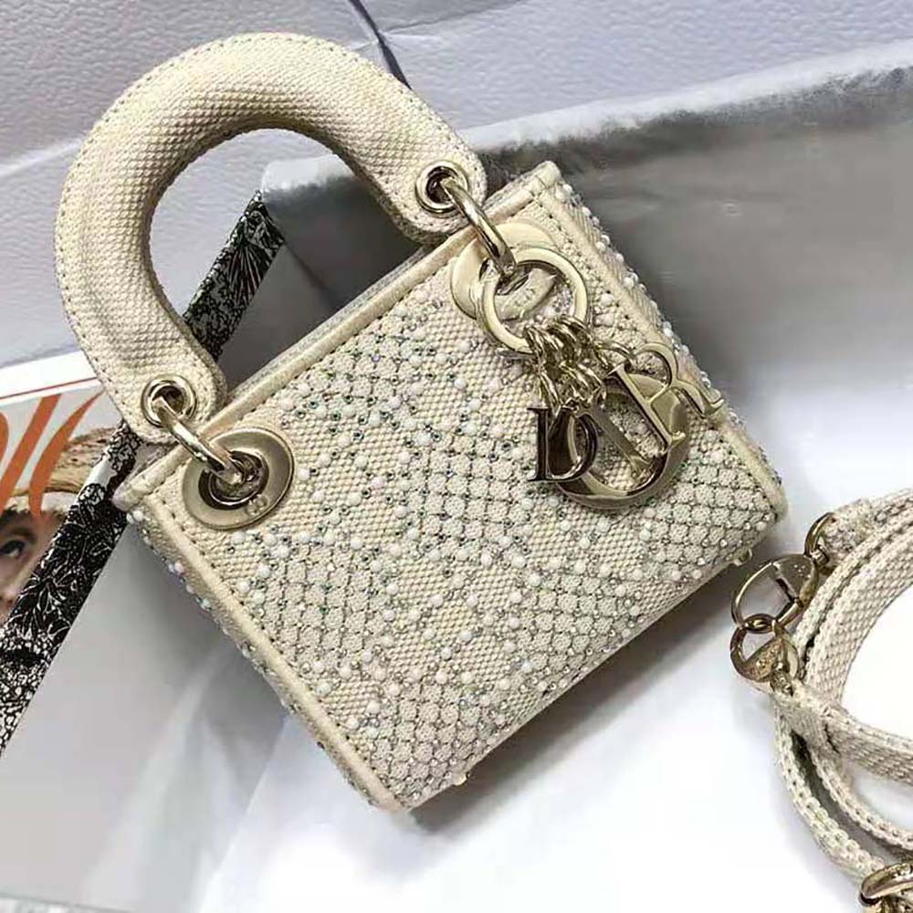 Close-up detail of embroidery and beads on Dior Women Micro Lady Dior Bag